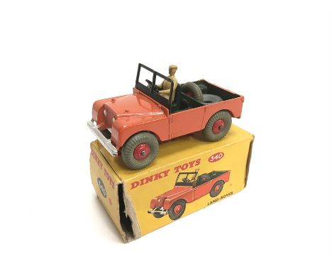 Dinky Toys 340 Land-Rover in orange with dark green interior, cast tan driver and red hubs. G/VG in F box missing one inner e