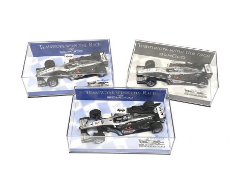 Three Minichamps 1/43 scale Schuco International West McLaren Mercedes special F1 models. M and boxed. 