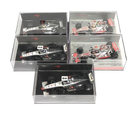 Five Minichamps 1/43 scale McLaren Team Edition F1 models: Vodafone McLaren Mercedes #503 074301; #503 074302; West McLaren M