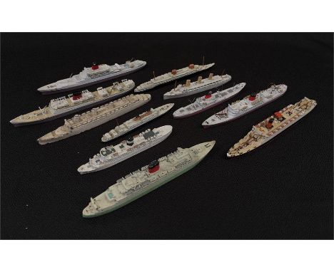 Eleven white metal ship models by Dinky and others. P-G unboxed. 