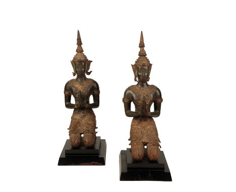 PAIR GILT AND PATINATED BRONZE KNEELING BUDDHAS, THAILAND, 20TH CENTURY, on black painted wooden bases