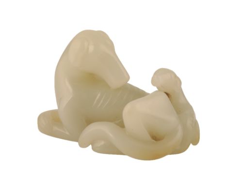 FINE CARVED WHITE JADE HOUND GROUP, QIANLONG PERIOD, modelled as a recumbent hound and a pup, 7cm widePLEASE NOTE: LIVE BIDDI