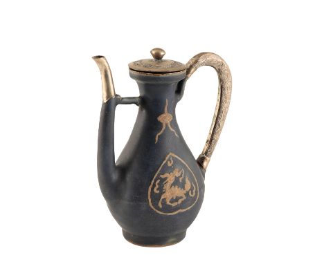BLUE-GLAZED PEAR-SHAPED EWER, WANLI PERIOD each side slip-decorated with a dragon in a leaf-shaped medallion with a cloud mot