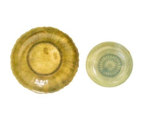 SPINACH JADE 'LOTUS' DISH, 23cm diam; together with a 'MUGHAL' CARVED JADE SHALLOW DISH, 16cm diam (2)