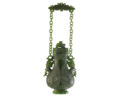 SPINACH JADE HANGING 'PHOENIX' VASE, LATE QING DYNASTY, of flattened baluster form, the sides carved with two phoenix, the pr