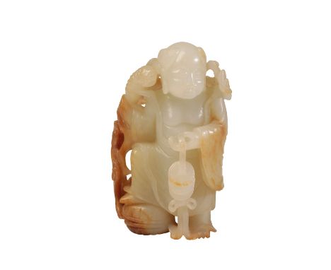 FINE CARVED WHITE AND RUSSET JADE DEITY, QING DYNASTY, the standing figure with a three legged toad resting on one shoulder a