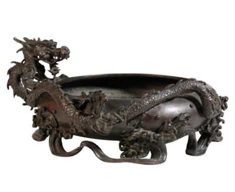 BRONZE 'DRAGON' CENSER, QING DYNASTY, 19TH CENTURY, the compressed globular sides applied with a coiled dragon and crashing w
