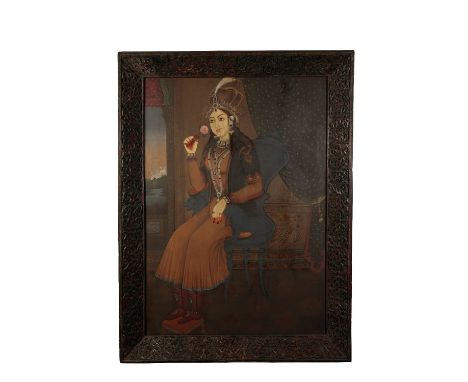 INDIAN SCHOOL (19TH CENTURY) PORTRAIT OF MUMTAZ MAHAL, WIFE OF SHAH JAHAN, in a painted and ornately carved wood frame, 95cm 