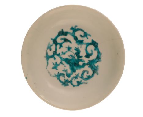 SWATOW TURQUOISE-ENAMELLED SAUCER DISH, LATE MING DYNASTY the interior well showing a foliate scroll roundel, the exterior wi