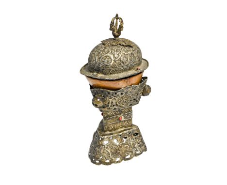 SILVERED-METAL MOUNTED HUMAN SKELL KAPALA, TIBET, 19TH CENTURY, skull is possibly associated 35cm high