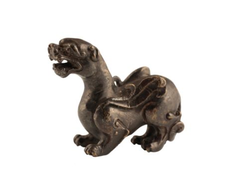 CHINESE BRONZE SCROLL WEIGHT, PROBABLY SONG DYNASTY, in the form of a chimera, the lion-like animal with wings and bifurcated