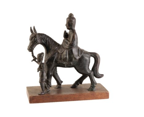 FINE BRONZE EQUESTRIAN GROUP OF PRINCE SIDDHARTHA AND ATTENDANT, LIAO DYNASTY, raised on a later wooden base, 30cm high