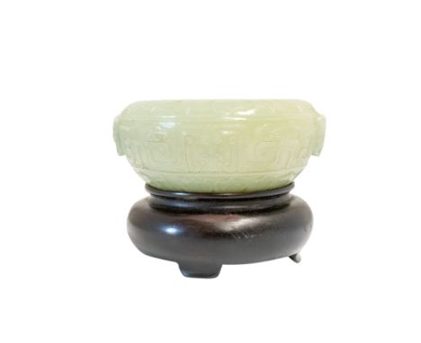 CARVED CELADON JADE CENSER, in the archaic style, 12cm diam, with a wood stand