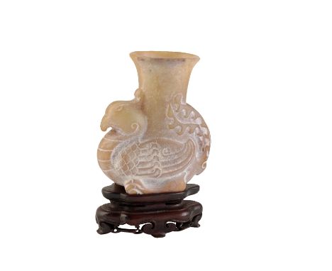 CARVED ARCHAIC STYLE JADE VASE, modelled as a resting phoenix, 8.5cm high, with a hardwood stand