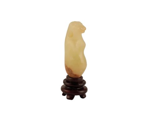 PALE CELADON JADE NEOLITHIC 'MEERKAT' PENDANT, PROBABLY HONGSHAN CULTURE, the upright creature with a swollen abdomen, the ne