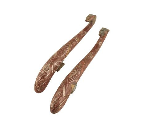 PAIR OF CHINESE ARCHAIC BRONZE BELT HOOKS, WARRING STATES, CIRCA 400BC, with inlaid scroll decoration in silver on a brown la