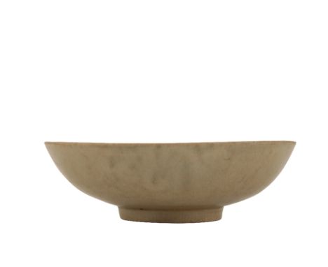 KOREAN CARVED CELADON SHALLOW BOWL, KORYO DYNASTY, 12TH / 13TH CENTURY, the gently-rounded body tapering toward the glazed fo