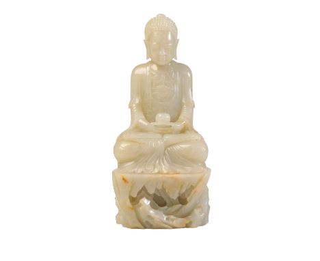 FINE WHITE JADE FIGURE OF AMITAYUS, QING DYNASTY, seated in vajraparyankasana on a rocky outcrop, his hands holding a vase, w