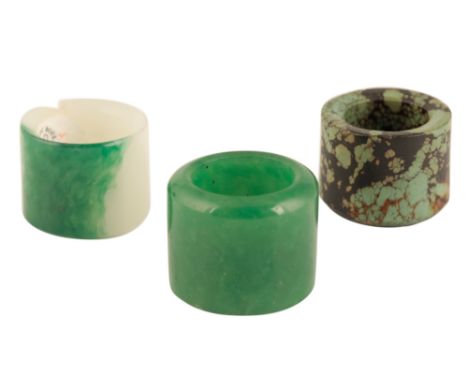 THREE ARCHER'S RINGS, QING DYNASTY, two in glass imitating jade, and a third in turquoise, the largest 3.3cm diam Provenance: