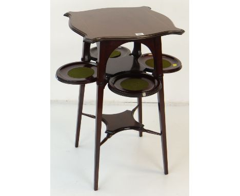 EDWARDIAN ART NOUVEAU INLAID MAHOGANY OCCASIONAL TABLE shaped top above four central drop down circular wine coasters, 45 x 4