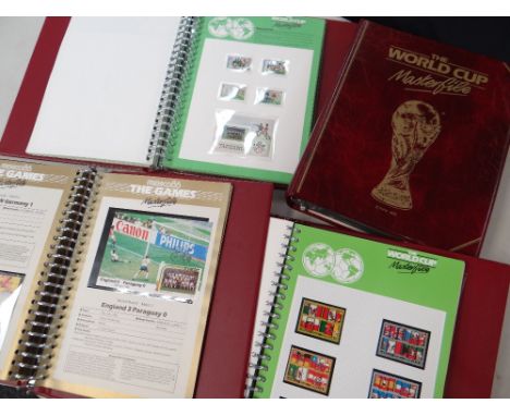 FOUR FIFA 1974 WORLD CUP MASTERFILE STAMP ALBUMS containing first day covers, stamps and autographs of selected players relat