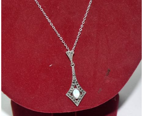 A silver marcasite and opal drop pendant necklace on silver chain, cased