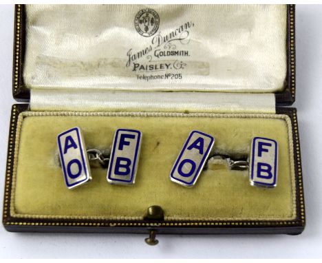 A pair of silver and enamel cufflinks in fitted case