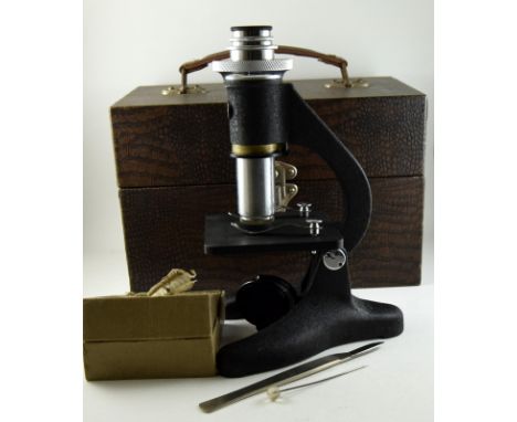 A Vintage Beck Simplex microscope in case with accessories