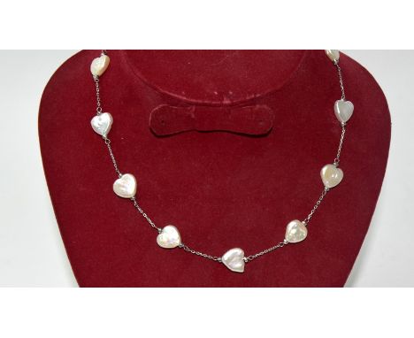 A silver and blister pearl heart shaped necklace