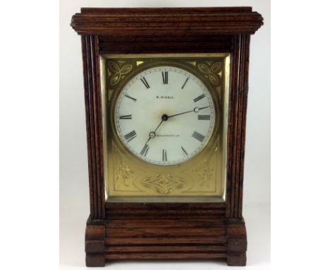 Small mahogany bracket clock by W Kibble London with Camerer Kuss & Co retail label to the back door