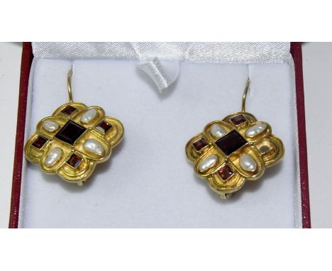 A pair of silver gilt earrings set with blister pearl and rubite