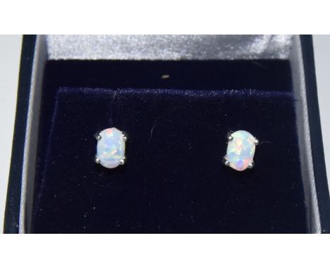 A pair of silver and opal stud earrings, boxed 