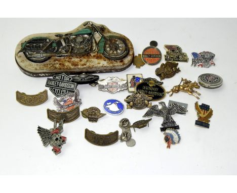 A collection of Harley Davidson items & badges