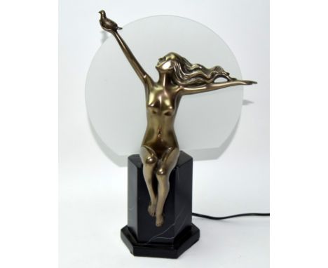 An Art Deco style lamp of a lady holding the Dove of Peace on stepped marble effect base