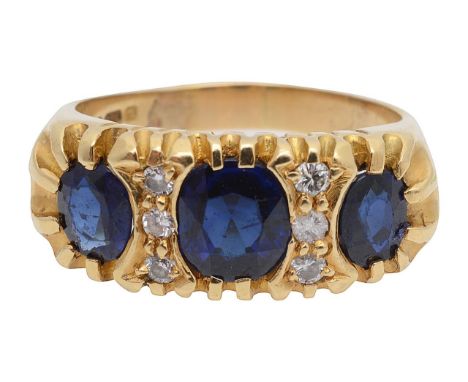 An 18ct sapphire and diamond dress ringwith 18ct hallmark stamp to band, graduating, three stone, mixed cut sapphires separat