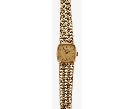 A 9ct gold Omega lady's manual wind wristwatchthe crazed gilt rectangular dial with baton numerals, with fancy link bracelet 