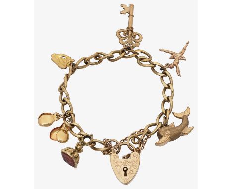 A 9ct gold charm braceletsuspending a number of charms including castanets, harp, dolphin and a keytotal weight approx 19gCon