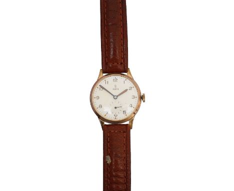 A 9ct gold Tudor Rolex manual wind wristwatchthe silvered circular dial with Arabic numerals and dot markers, with presentati