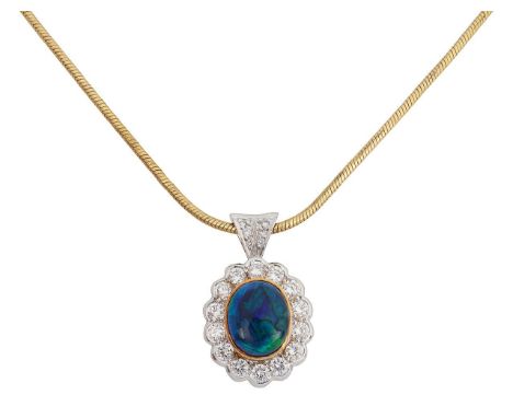 A black opal and diamond cluster pendant on an 18ct chainfeaturing an oval cabochon opal, bezel set in yellow gold with a whi
