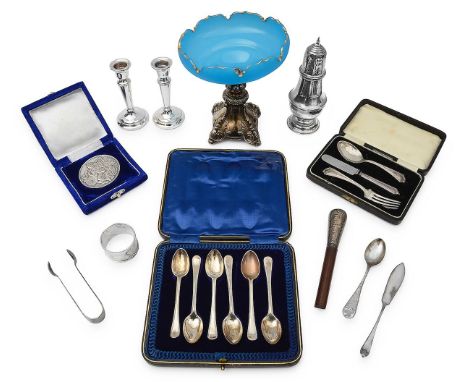 A collection of silvervarious dates, makerscomprising an Elizabeth II sugar caster, a pair dwarf candlesticks, a cased Indian