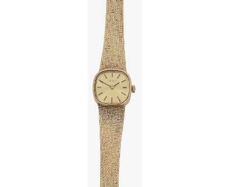 A 9ct gold lady's Tissot bracelet wristwatch the rounded champagne dial with baton numerals, with textured bracelet, stamped 