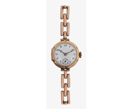 A lady's 9ct gold manual wind wristwatch the enamel dial with Arabic numerals and subsidiary seconds, moon hands, expandable 