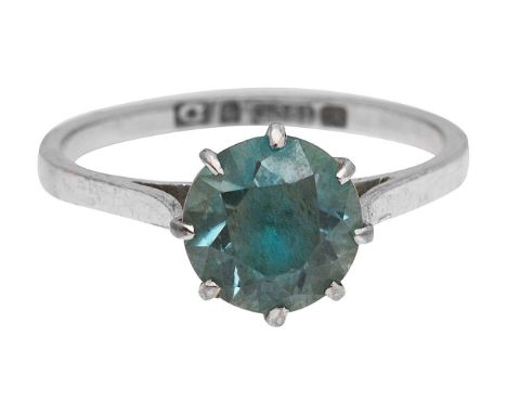 A blue zircon single stone ringthe circular mixed-cut zircon coronet-set above the plan shank stamped '18ct' ring size K, 2.1