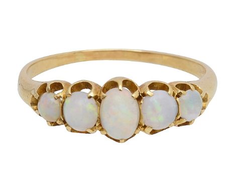 An opal five stone graduating ringfeaturing five cabochon cut natural opals held in yellow gold claw settings to a plain curv