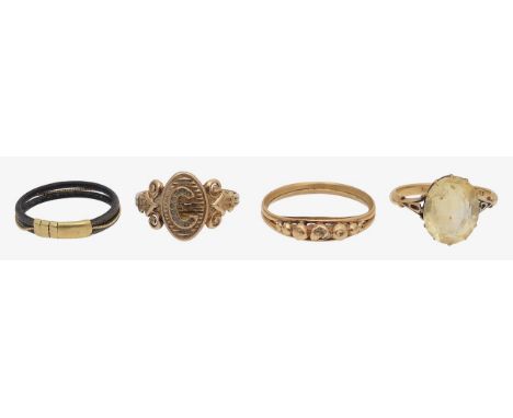 A citrine ring, a signet ring an elephant hair ring and two other 18k stamp to band, oval 'mixed cut' citrine held in a claw 