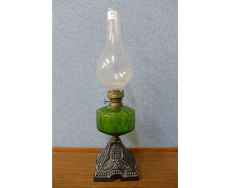 A Victorian cast iron based oil lamp
