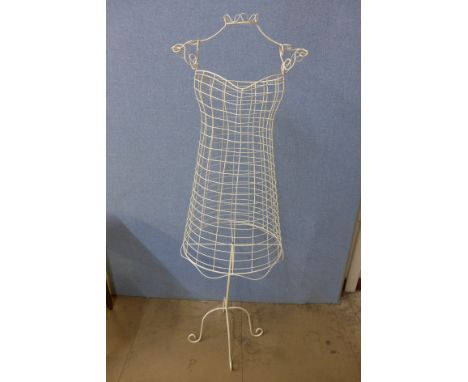 A painted wire work mannequin