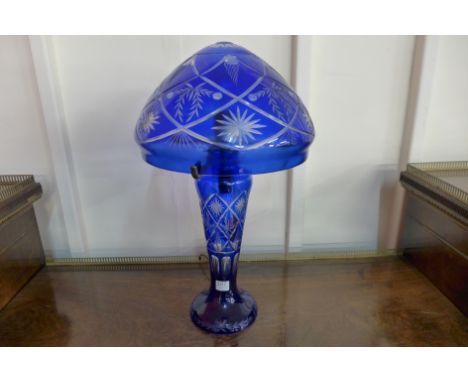 A blue cased glass table lamp