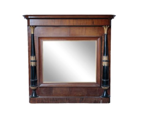 EMPIRE MAHOGANY EBONISED AND PARCEL-GILT OVERMANTEL MIRROR of architectural design, the rectangular plate flanked by ebonised