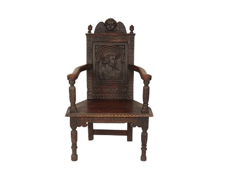 RENAISSANCE STYLE OAK ARMCHAIR, the cresting rail carved with a winged cherub over an arcaded panel carved with a portrait bu